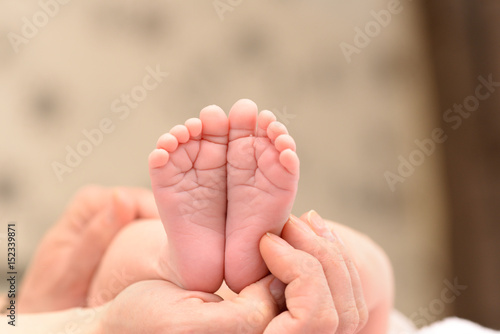 Baby soles in the mother's hands