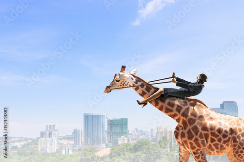 Canvas Print Woman ride giraffe