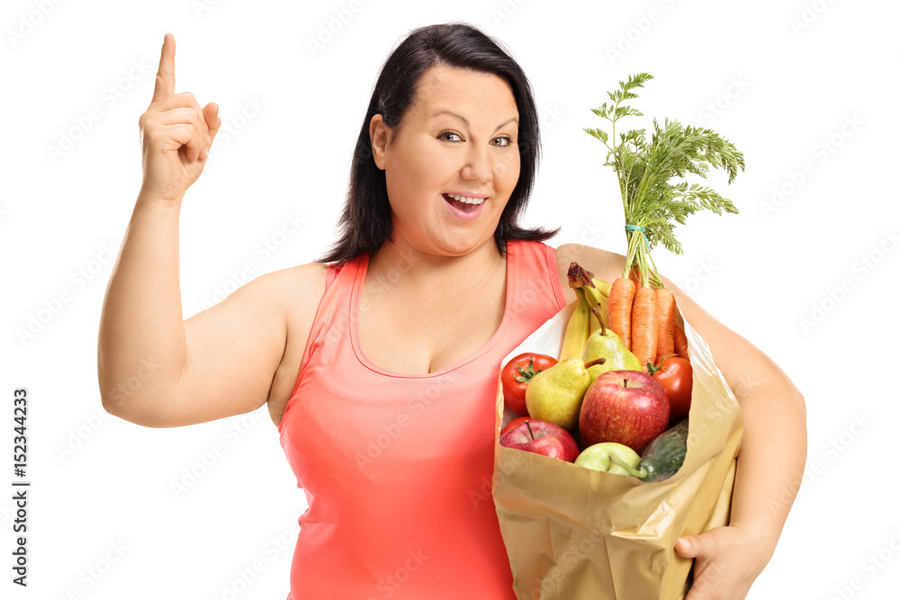 Overweight woman with a paper bag holding her finger up Overweight woman with a paper bag holding her finger up