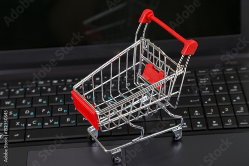 Shopping basket on a laptop.