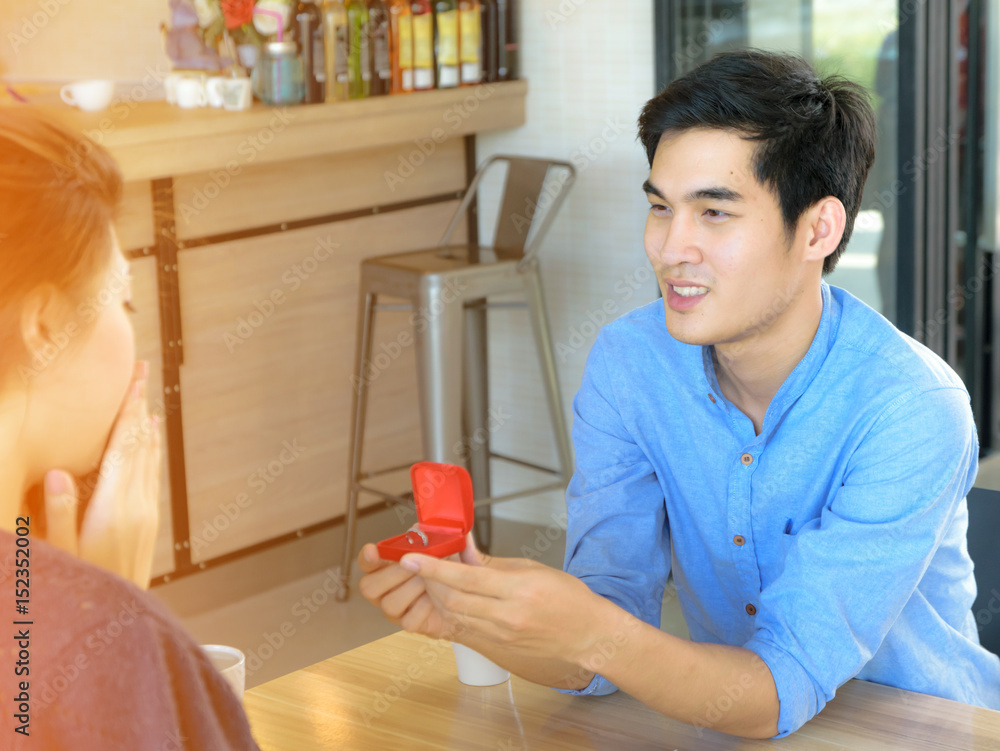 Concept Couples activities in the coffee shop,man propose woman Concept Couples activities in the coffee shop,man propose woman