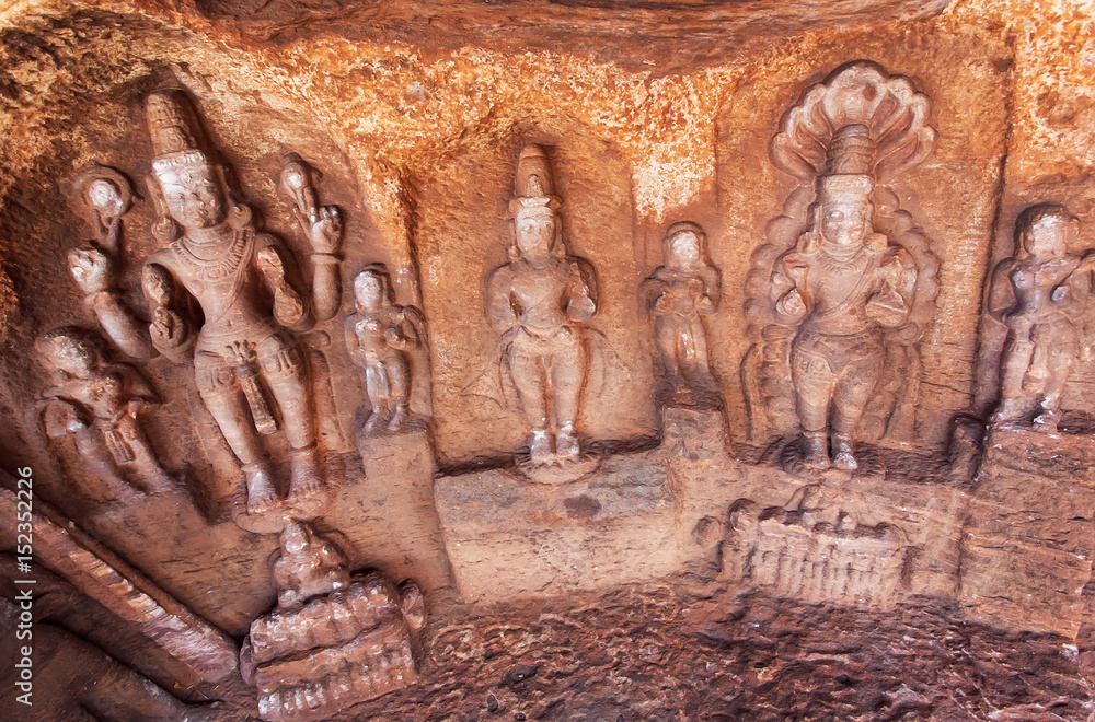Fototapeta premium Lord Shiva and other Hindu gods in natural cave in Badami town, India.