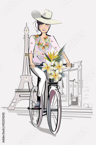 Fashion Girl in the hat on the bicycle in Paris.