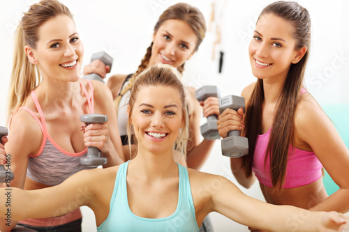 Young women group taking selfie at the gym after workout