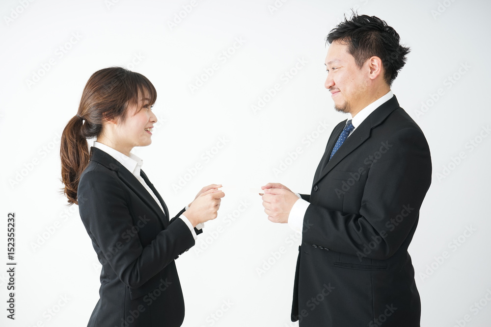 Business persons exchanging business cards Business persons exchanging business cards