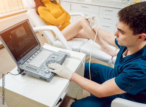 Patient with orthopedist doctor in his office. photo