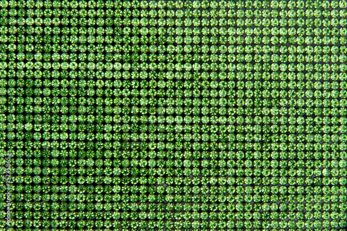 Canvas of green rhinestones. Background.