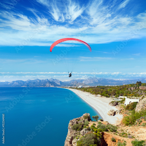 Fototapeta Naklejka Na Ścianę i Meble -  Paragliders flying above Konyaalti beach in Antalya, Turkey