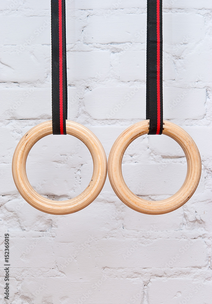 Gymnastic rings on the background of a brick wall Gymnastic rings on the background of a brick wall