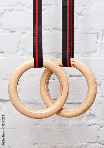 Gymnastic rings on the background of a brick wall