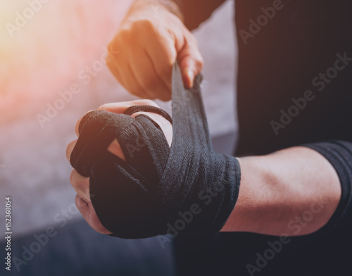 A street fighter puts elastic bandages. photo