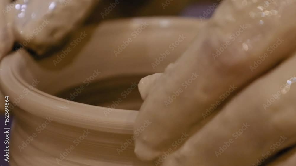 Potter is making clay pot bowl or vase ceramics porcelain on the potter's wheel. Creating pottery art and handicraft modelling creation. Potter is making clay pot bowl or vase ceramics porcelain on the potter's wheel. Creating pottery art and handicraft modelling creation.