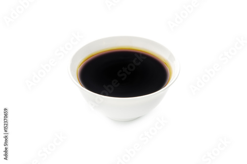 Soy sauce in bowl isolated on white