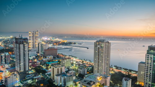 Beautiful Manila city shore Manila Bay skyline during sunset photo