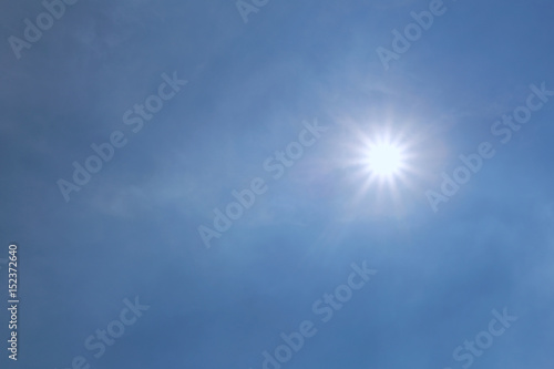 sun and the beam on the blue sky background.