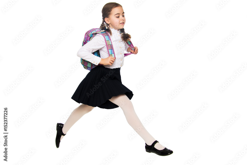 A schoolgirl girl is jumping over obstacles. A schoolgirl girl is jumping over obstacles.