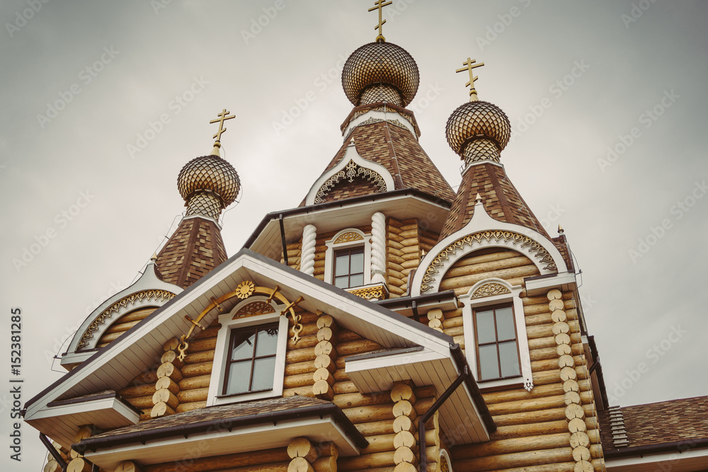 Domes with crosses, Modern wooden orthodox church Domes with crosses, Modern wooden orthodox church