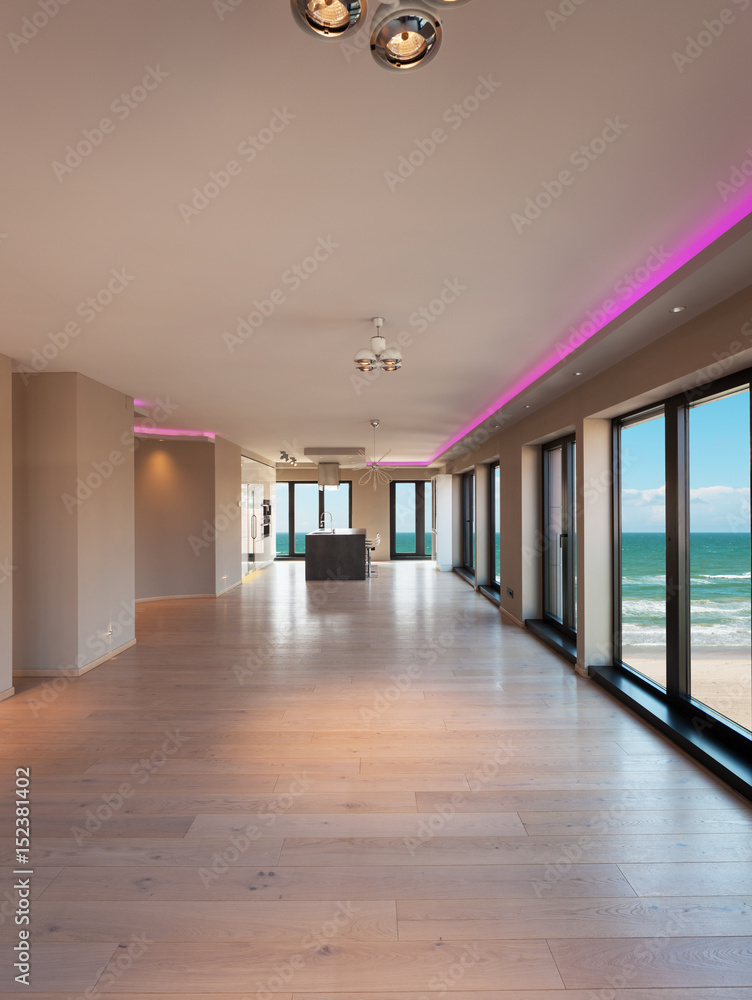 Interiors of a modern apartment, dining room with sea view