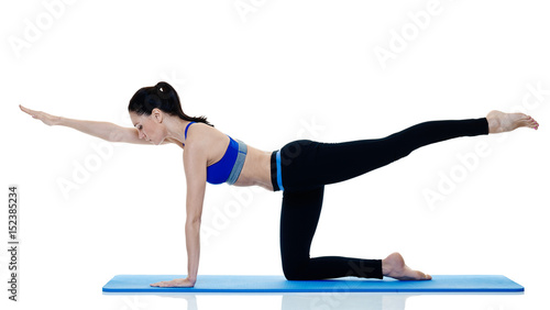 one caucasian woman exercising fitness pilates exercices isolated on white background