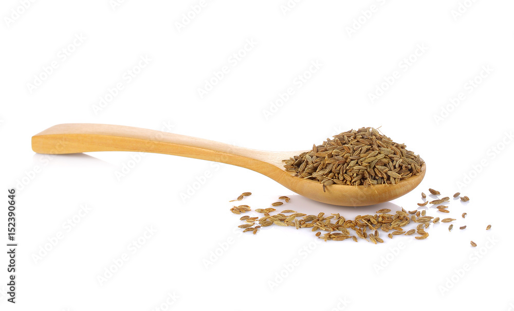 Ground cumin in a spoon, isolated on white background. Ground cumin in a spoon, isolated on white background.