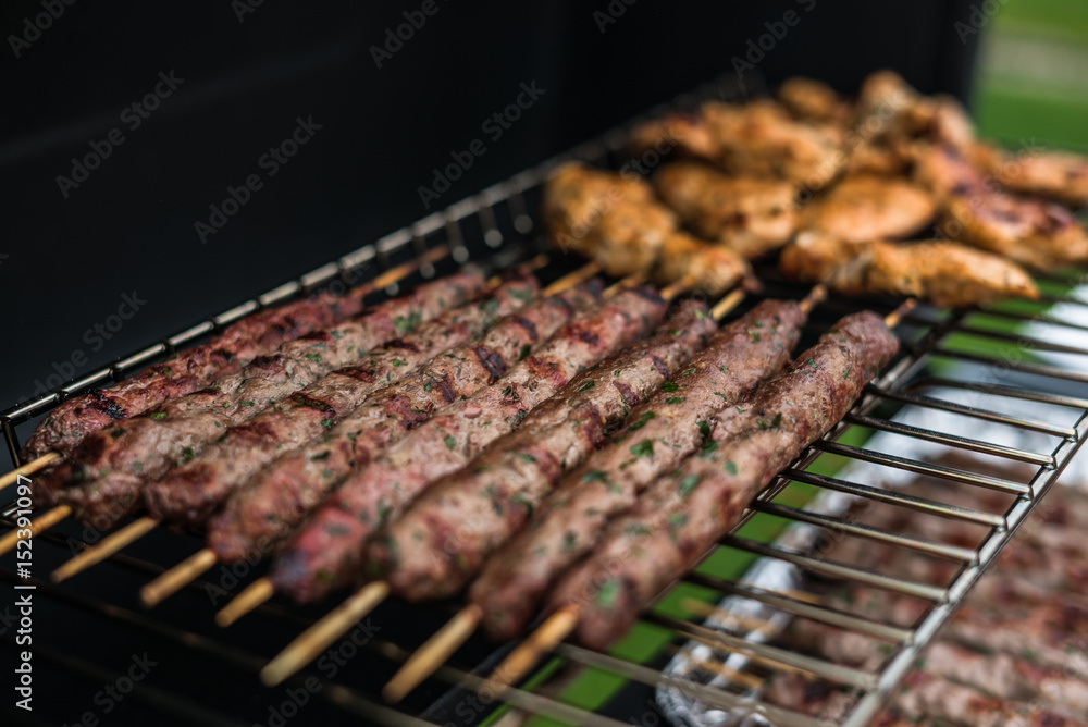 Barbecue grill party. Tasty Fresh food. Shrimps spit and Beef rolls with bio young spices, chicken strips. bio vegetables Barbecue grill party. Tasty Fresh food. Shrimps spit and Beef rolls with bio young spices, chicken strips. bio vegetables
