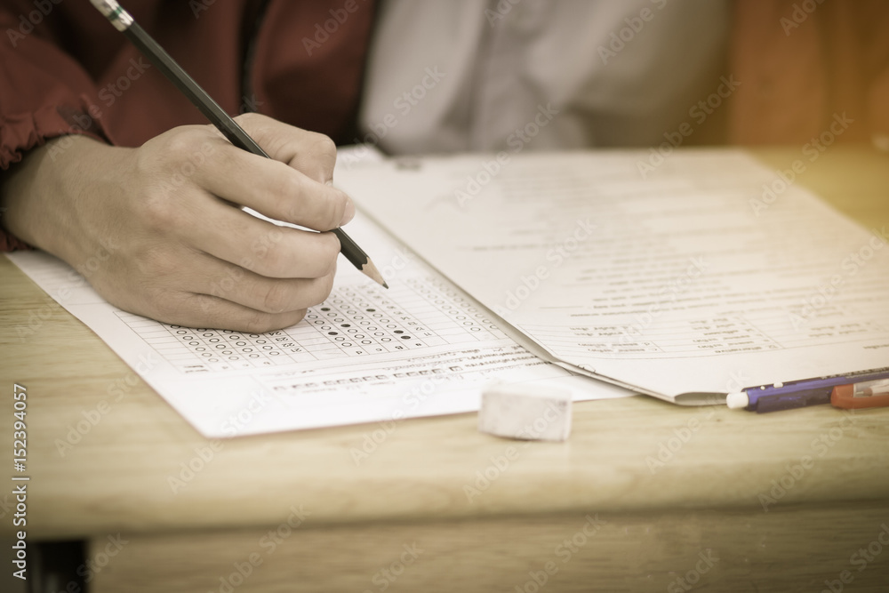 Blurred of student testing in exercise, exams answer sheets or test paper with red pen, : education concept