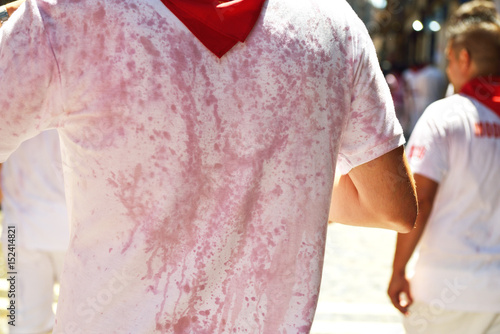 Man's t-short in wine, San Fermin festival, 06 July 2016, Pamplona, Navarra, Spain. photo