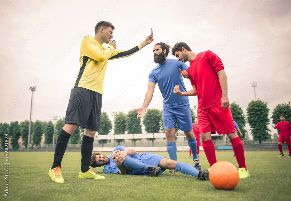 Fototapeta premium Referee showing the yellow card