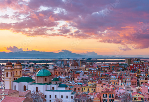 Sunset on Cagliari, evening panorama of the old city center in Sardinia Capital, view on The Old Cathedral and colored houses in traditional style, Italy photo