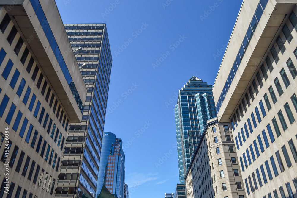 The glass skyscraper reflecting the clouds in Montreal downtown