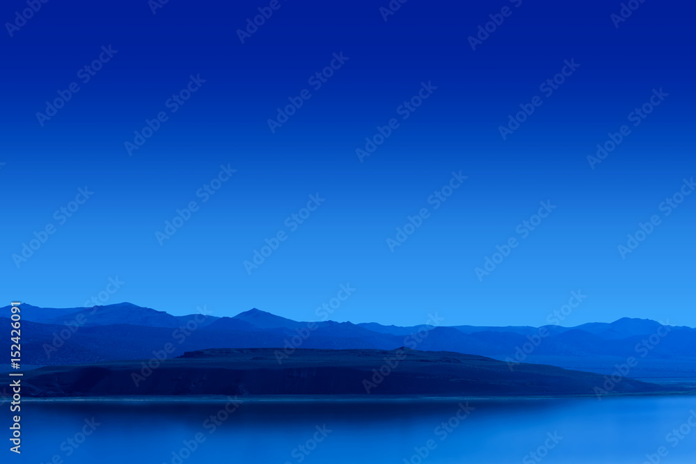 Blue Night Lake with Mountains Background