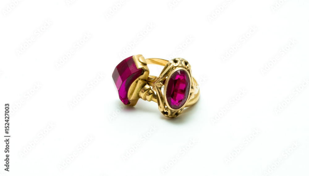 Old gold rings with purple stone (amethyst) isolated on white background. Old gold rings with purple stone (amethyst) isolated on white background.