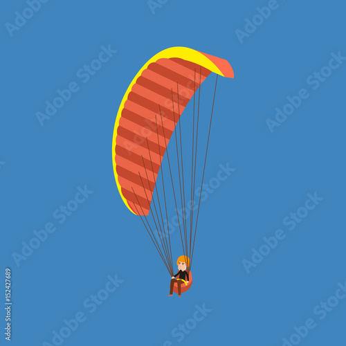 Man paragliding on a parachute. Parachutist descending with a parachute.