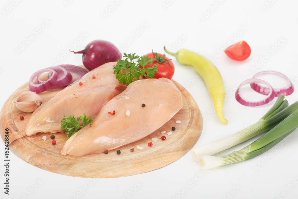 Raw chicken breasts on cutting board Raw chicken breasts on cutting board