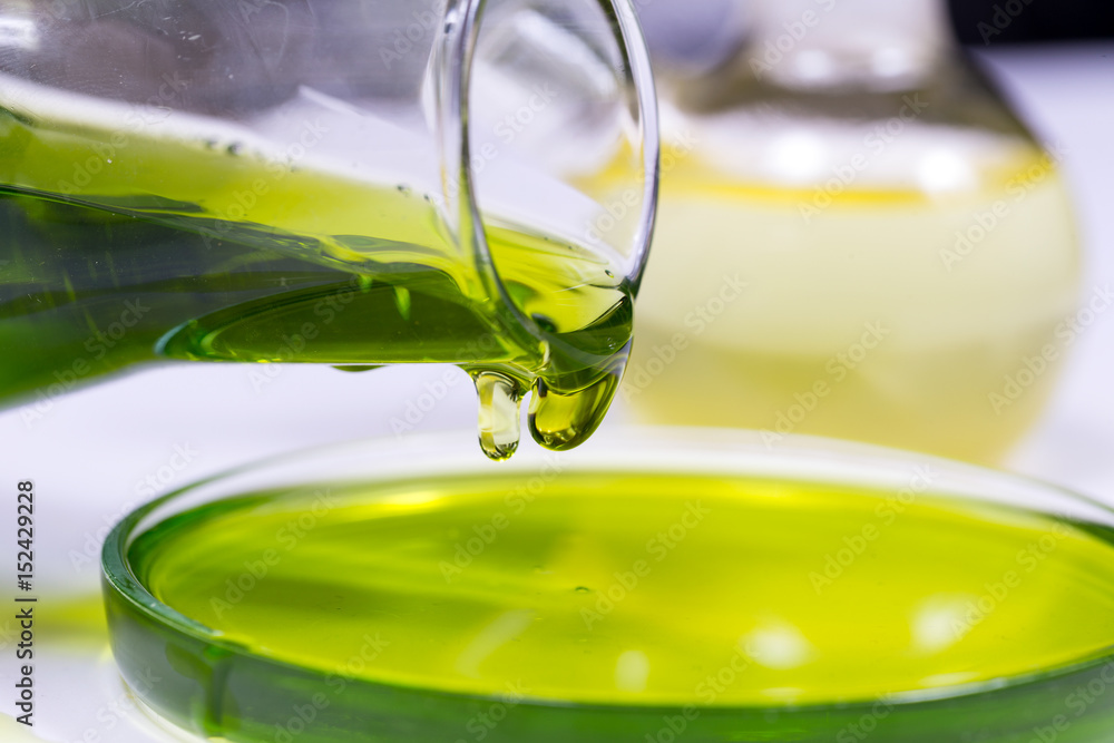 Flask for chemical experiments with green liquid Flask for chemical experiments with green liquid