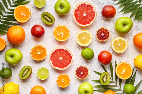Citrus fruits background mix flat lay  summer healthy vegetarian food  antioxidant detox nutrition diet