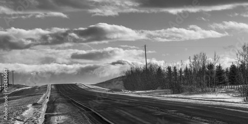 Snow covered highway in Alberta, Canada © klevit