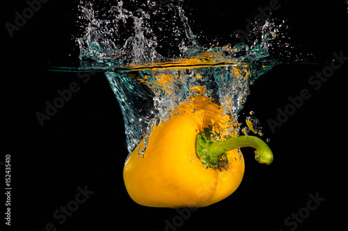 Yellow Bell Sweet Pepper Droped Into Water