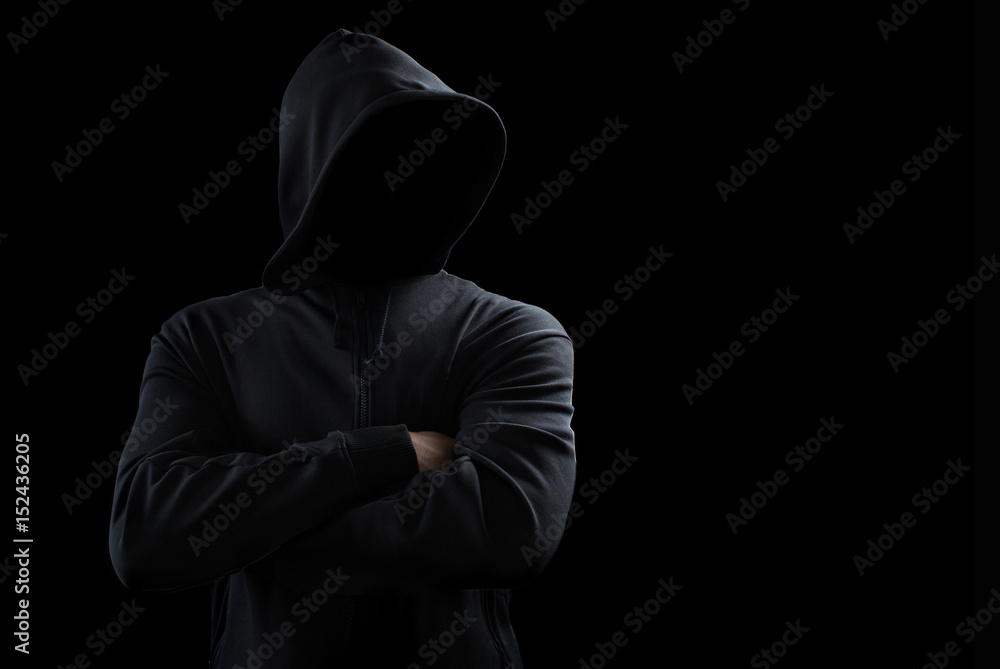 Unknown person concept.Hooded silhouette on black, with no face Unknown person concept.Hooded silhouette on black, with no face