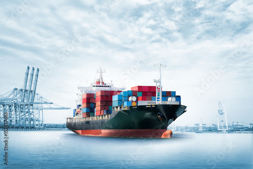 Logistics import export background of Container Cargo ship in seaport on blue sky, Freight Transportation