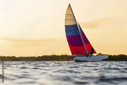 Recreational Sailer Sailing During Sunset