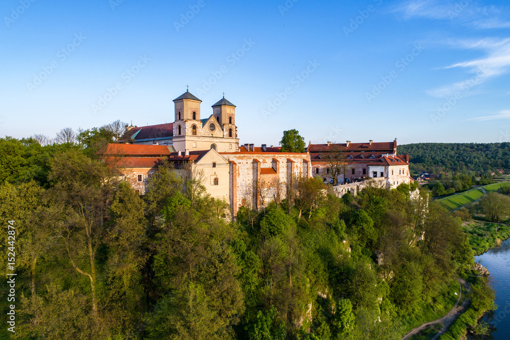 Benedictine abbey on the rocky hill in Tyniec near Cracow, Poland and Vistula River. Aerial view at sunset