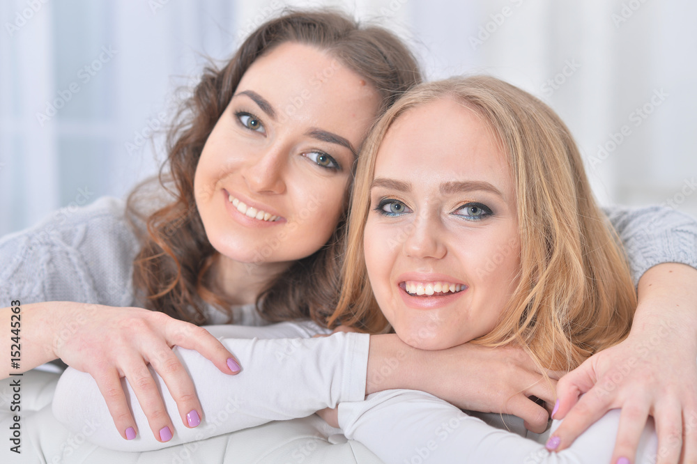 Embracing girlfriends close-up Embracing girlfriends close-up