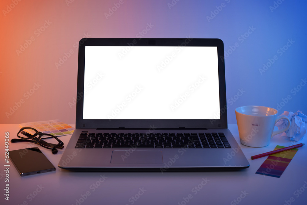 Fototapeta premium Colorful workplace - laptop computer with blank screen