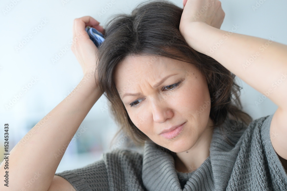 Fototapeta premium Young woman with a headache