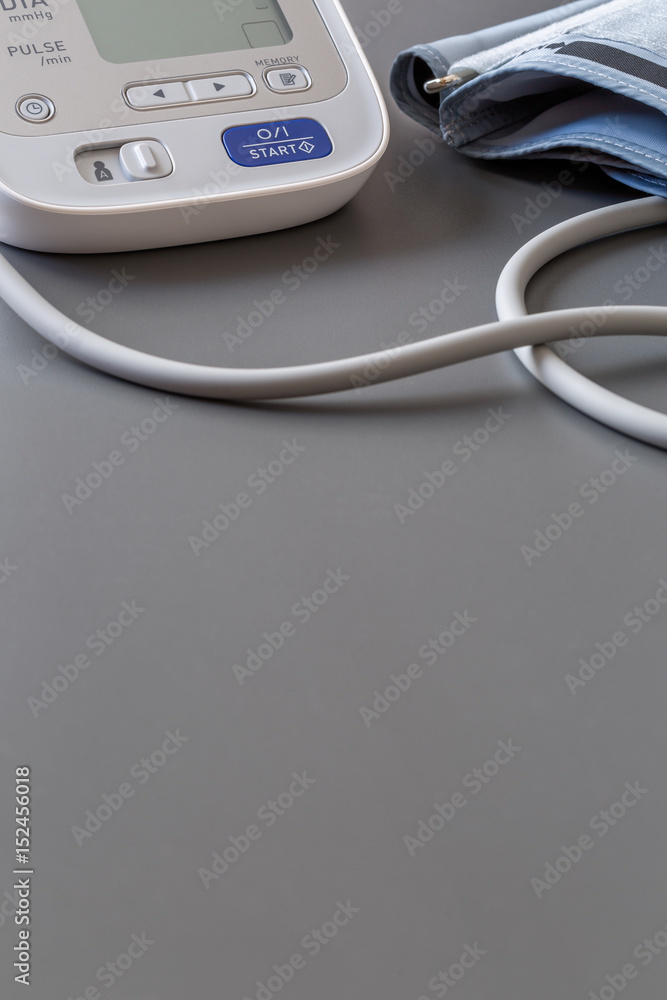 Electronic tonometer on the grey table, pressure measurement Electronic tonometer on the grey table, pressure measurement