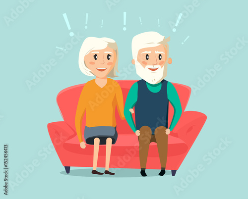 Happy Old senior man and woman seating together on sofa in the room