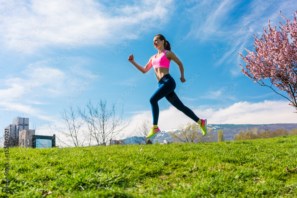 Woman sport running on hill for fitness Woman sport running on hill for fitness