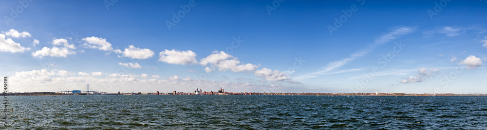 Stralsund, Germany - April 2017: Panoramic view on the harbor of famous Stralsund and its historic churches on a beautiful spring day.