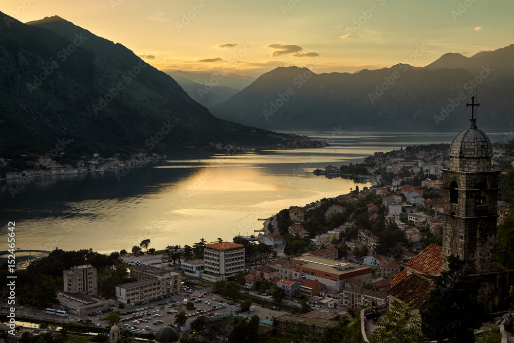 Montenegro Kotor bay sunset landscape summer travel destination, old town with church building panoramic view, Adriatic sea water coast harbor